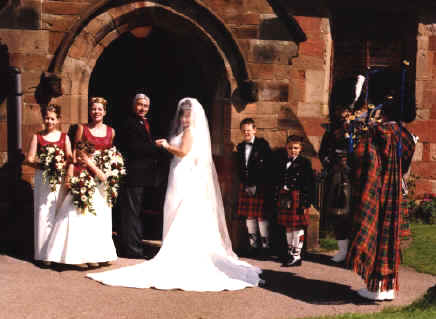 Pipers play in the bride.